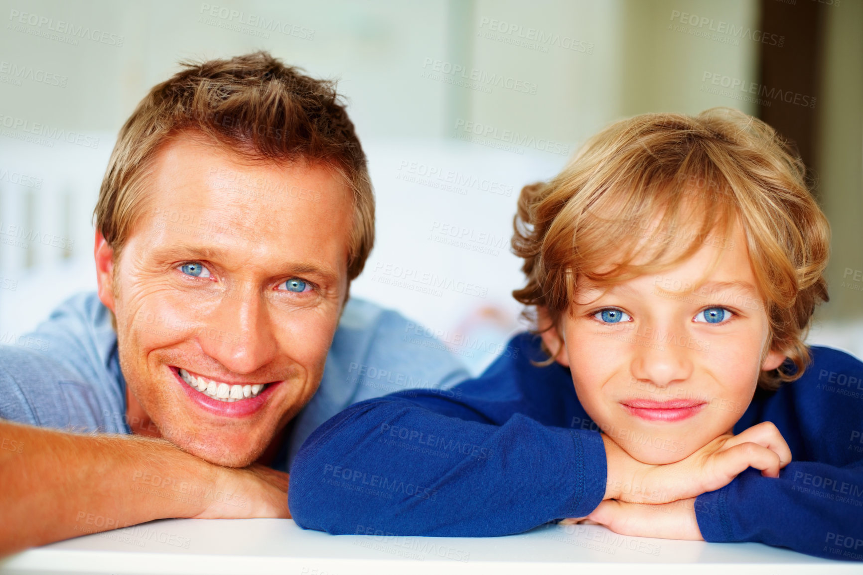 Buy stock photo Happy, portrait and father with boy on bed for bonding, relaxing and spending time together. Smile, love and young dad chilling and resting with kid or child from Australia in bedroom of house.