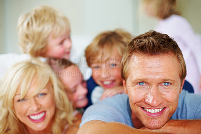 Buy stock photo Happy, portrait and parents with children on bed for bonding, relaxing and spending time together. Smile, love and young mother and father resting with kids from Australia in bedroom at family home.