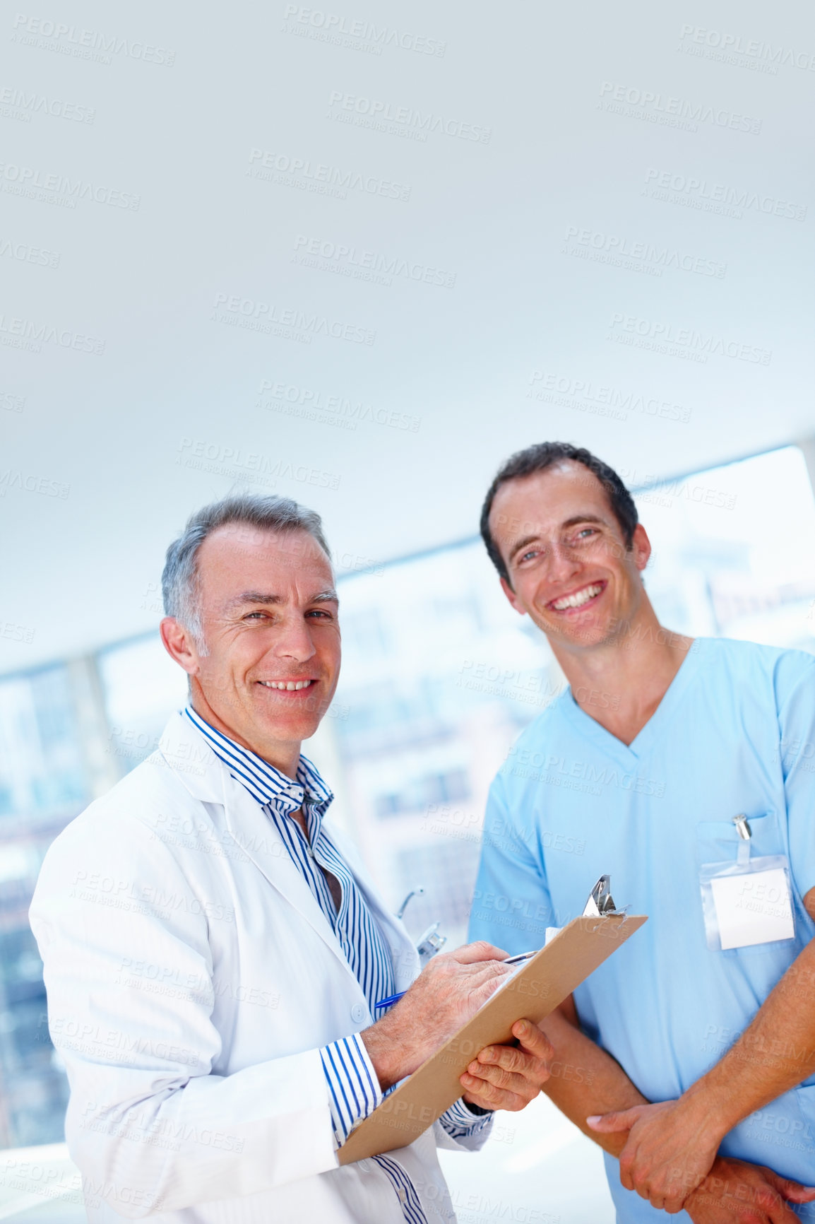 Buy stock photo Portrait, doctor and nurse with healthcare, clipboard and smile with teamwork, results and cooperation. Face, medical or professional with documents, collaboration or wellness with hospital or happy