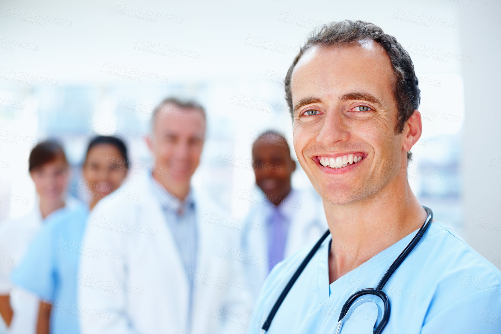 Buy stock photo Doctors, man and team portrait in clinic with staff, leadership or together for healthcare services. Medic, group and solidarity with diversity for inclusion, women or nurses with support in hospital