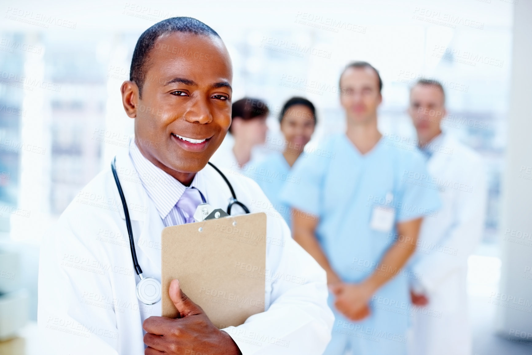 Buy stock photo Doctor, black man and portrait of clipboard with medical, healthcare and clinic staff in a hospital. Teamwork, job and stethoscope of a nurse and surgeon with professional team ready for working