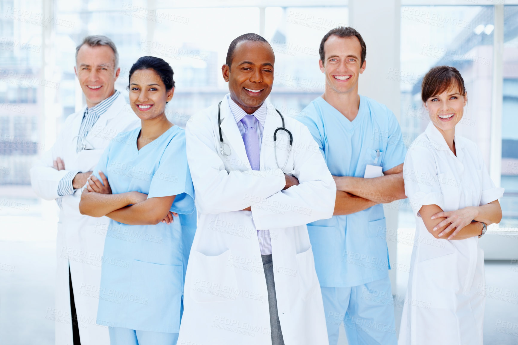 Buy stock photo Doctors, man and arms crossed in group at hospital with staff, leader or team for healthcare services. Medic, portrait and solidarity for diversity for inclusion, women or nurses in support at clinic