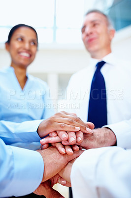 Buy stock photo Business people, hands together and meeting in teamwork for motivation, unity or collaboration at office. Group of employees piling for building, diversity or support in community trust at workplace