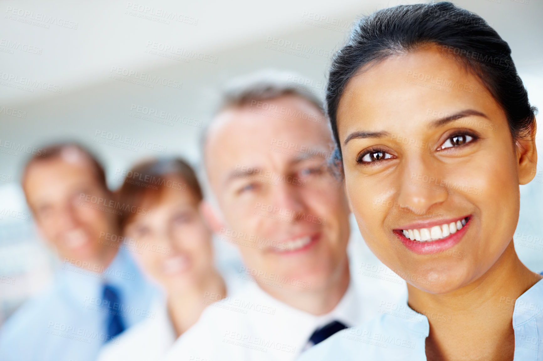 Buy stock photo Happy, portrait of business woman with team in the office for positive, good and confident attitude. Smile, collaboration and professional young Indian female designer with people in workplace.