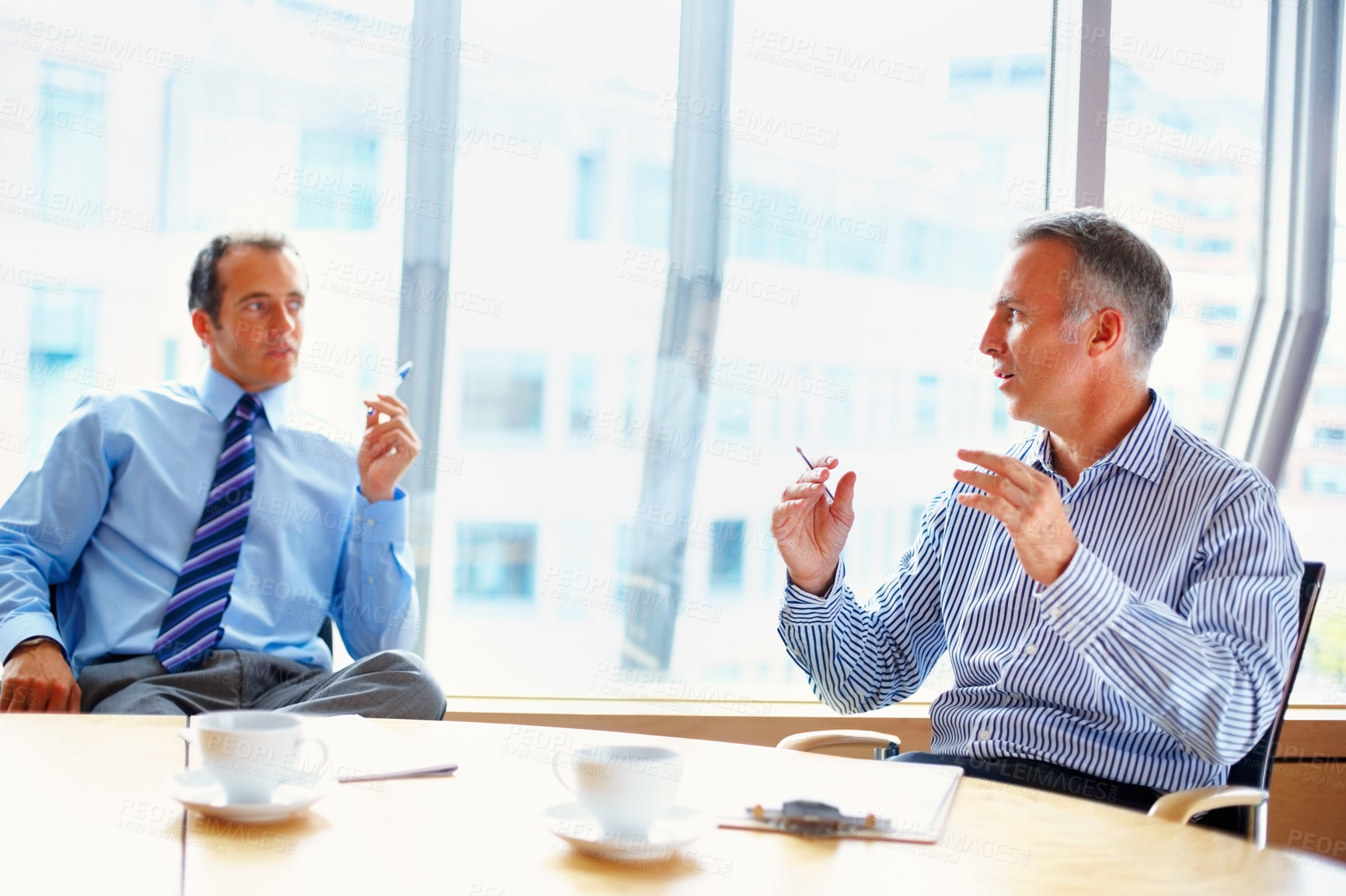 Buy stock photo Meeting, discussion and business people in office for management conversation, talking and planning. Corporate workers, teamwork and men in conference room for strategy, collaboration and consulting