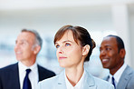 Female executive with colleagues in background