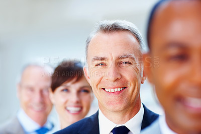 Buy stock photo Businessman, portrait and manager for team, line and ceo or director for business in office. Colleagues, happy and smile for leadership and male person for pride, diversity and corporate entrepreneur