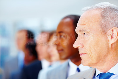 Buy stock photo Mature, businessman and team in line in office with leadership, thinking and director of corporate company. Professional, CEO or collaboration with employees for management, executive or mockup space