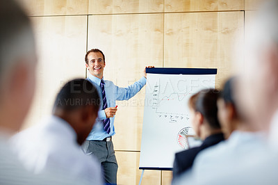 Buy stock photo Business people, man and presentation with charts, workshop and conference with conversation, invest and coaching. Group, seminar or presenter with graphs, mentor and statistics with project or plans