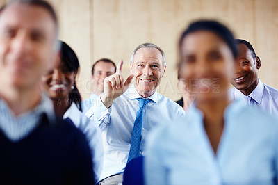 Buy stock photo Happy businessman, meeting and question in seminar for interaction or collaboration at office. Senior man hands raised for answer, idea or solution in team conference or staff training at workplace