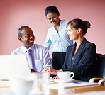 Smiling executives listening to colleague