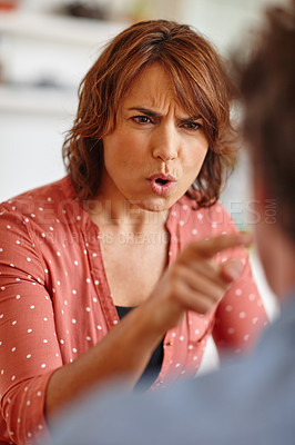 Buy stock photo Cropped shot of a woman arguing with her husband at home