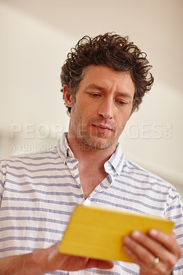 Buy stock photo Cropped shot of a mature man using a digital tablet