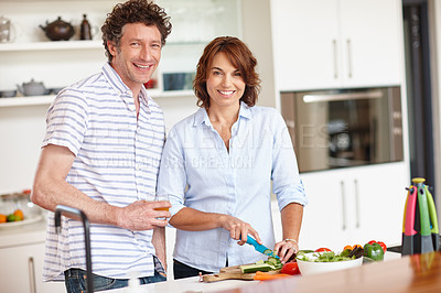 Buy stock photo Portrait of a happy mature couple cooking a healthy meal together at home