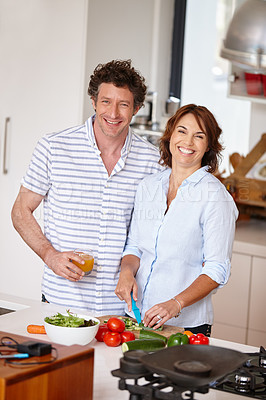 Buy stock photo Portrait of a happy mature couple cooking a healthy meal together at home