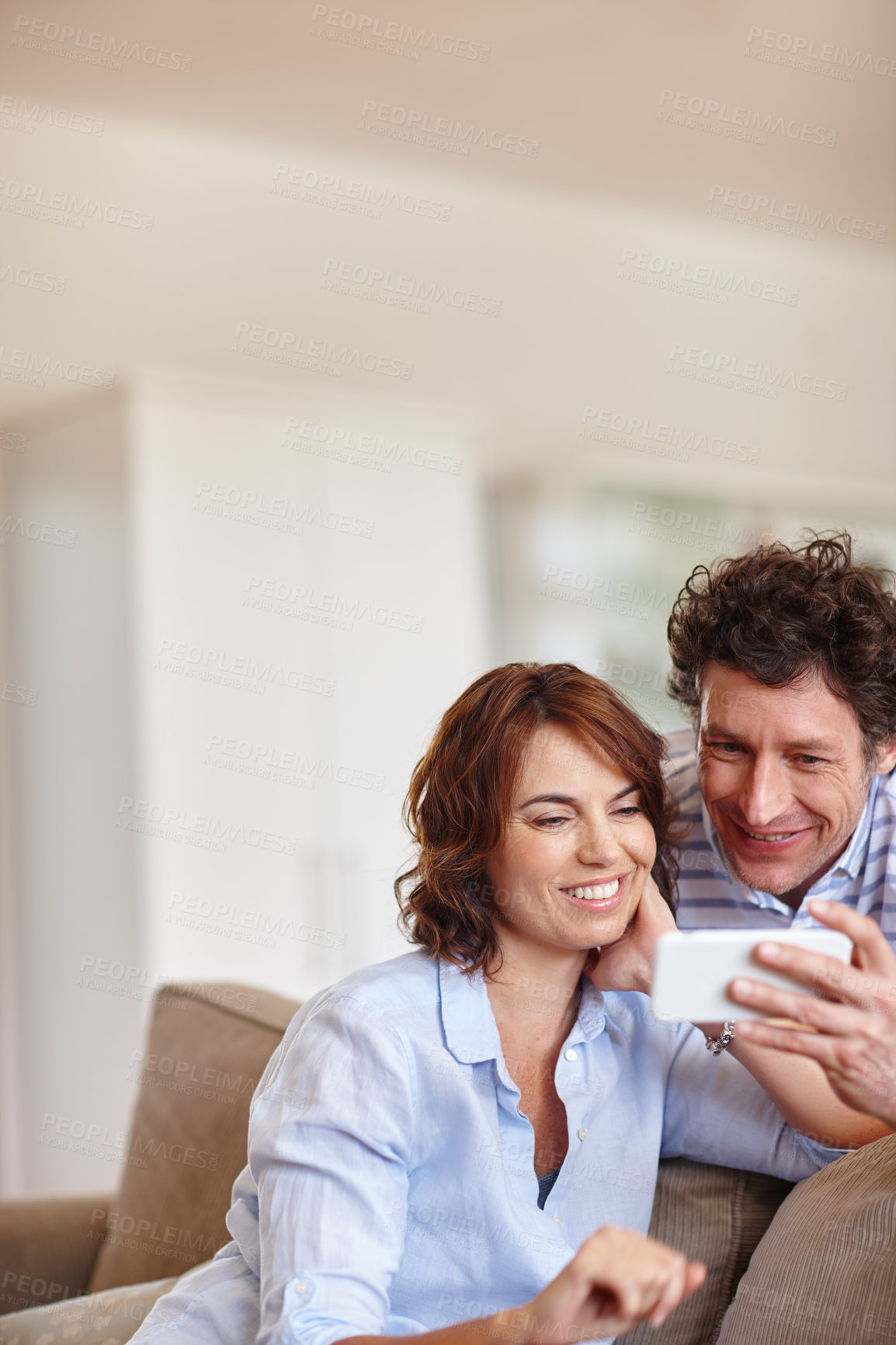 Buy stock photo Happy couple, relax and picture with selfie on sofa in home for photography, weekend or post. Man, woman or smile with capture moment on couch for social media, holiday or memory together in house