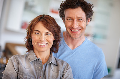 Buy stock photo Portrait of a happy mature couple spending time together at home