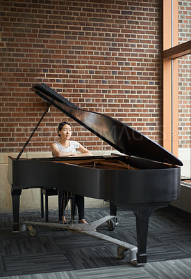 Buy stock photo Piano, musician or woman in a house for music training in an artistic classical performance in Japan. Lady pianist, relax and female person playing a song, learning jazz or practice routine in home