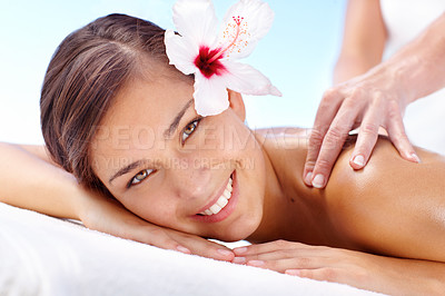 Buy stock photo Back massage, flower and portrait of happy woman at spa for health, skin and calm for wellness. Masseuse hands, beauty and face of girl at salon with natural hibiscus for therapy, relax or treatment