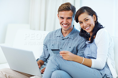 Buy stock photo Affectionate young couple at shopping online using laptop