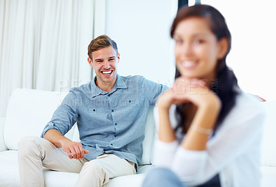 Buy stock photo Portrait, man and laughing with woman on couch for relax, together and morning in home or lounge. Happy, couple and support or love in apartment for weekend, bonding and trust on sofa in living room