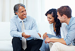 Couple discussing with financial planner