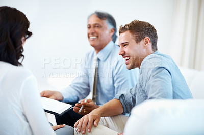Buy stock photo Smiling young man and woman discussing financial plan at home with financial advisor