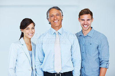 Buy stock photo Portrait of smiling business team with happy mature business man leading