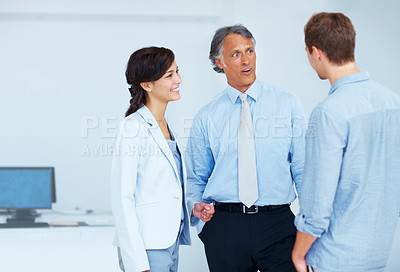 Buy stock photo Portrait of surprised mature business man with young woman listening to coworker