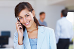 Attractive business woman talking on cellphone