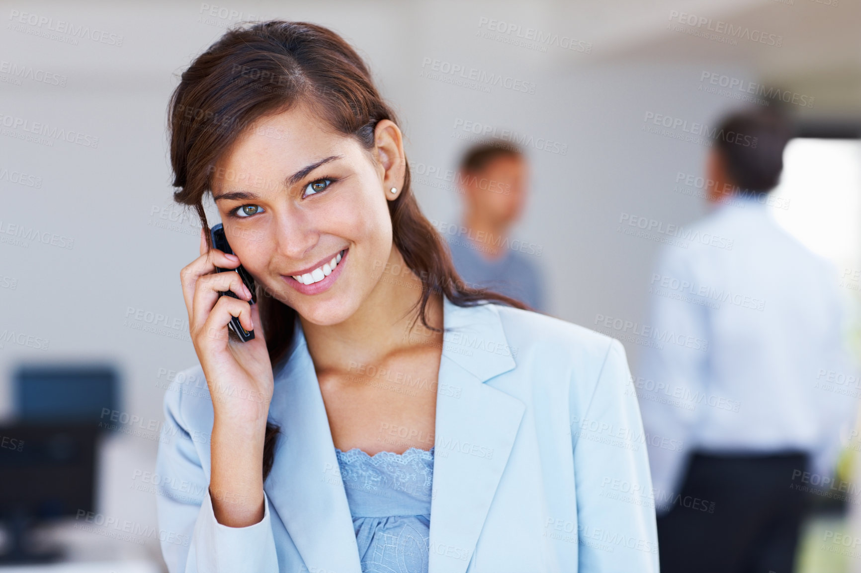 Buy stock photo Closeup of young attractive business woman smiling on call with business people in background