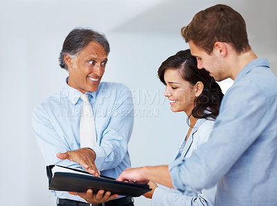 Buy stock photo Portrait of surprised mature business man during the conversation with young colleagues