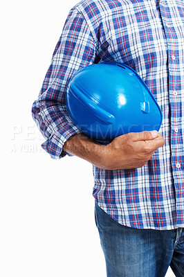 Buy stock photo Closeup of architect holding protective helmet over white background