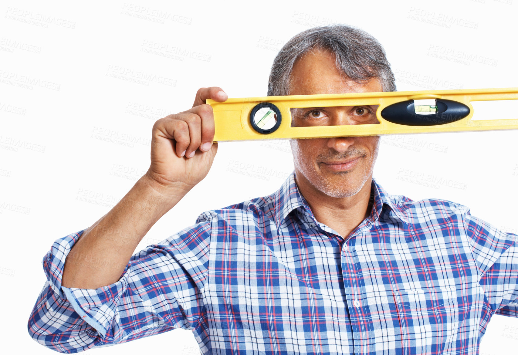 Buy stock photo Portrait of mature architect looking through spirit-level over white background