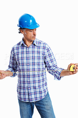 Buy stock photo Handsome architect in hardhat holding tape measure over white background