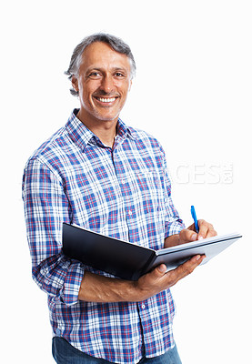 Buy stock photo Smiling business man working on a file over white background
