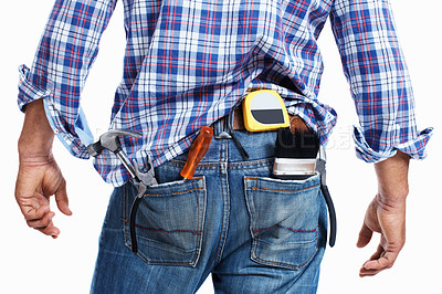 Buy stock photo Mid section of male construction worker with work tools in jeans Pocket