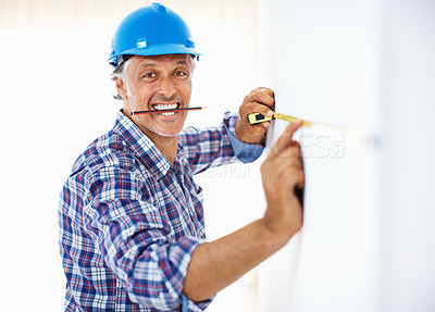 Buy stock photo Portrait of mature engineer at work holding pencil in mouth