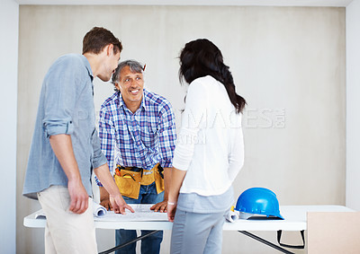 Buy stock photo Couple consulting mature engineer for home renovation