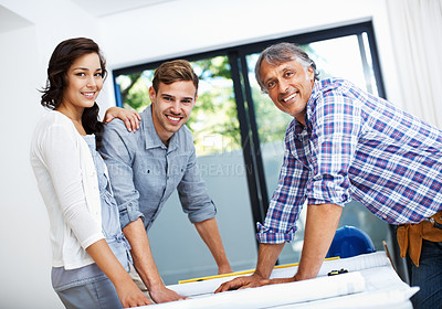 Buy stock photo Portrait of mature contractor with attractive couple smiling in office