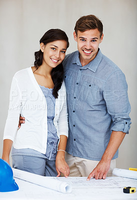 Buy stock photo Portrait of happy young couple smiling while discussing home renovation plans