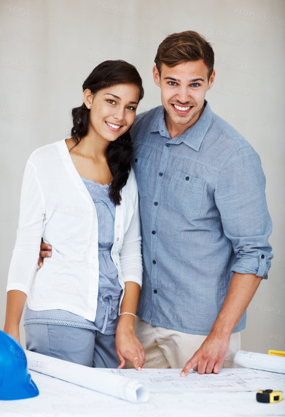 Buy stock photo Portrait of happy young couple smiling while discussing home renovation plans