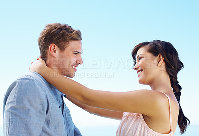 Buy stock photo Outdoor, couple and smile with hug for bonding with love, trust and support in Spain. People, relationship and happy for care on holiday or vacation for honeymoon to relax, break and fun as soulmate