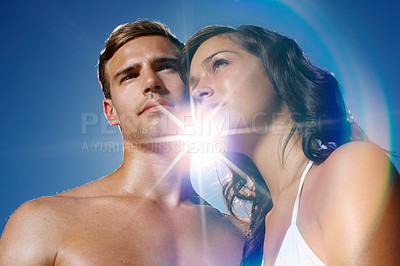 Buy stock photo Sky, confident and embrace of couple, bikini and outdoor in vacation, love and shirtless in summer. People, hug and together for date, woman and man in relationship for romance, holiday and relax