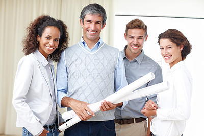 Buy stock photo Portrait of a group of four architects smiling happily at the camera