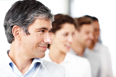 Buy stock photo Closeup shot of a smiling group of young business professionals standing in a row