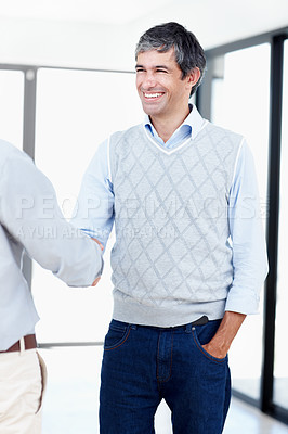 Buy stock photo Shot of two positive-looking businessmen shaking hands