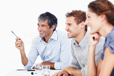 Buy stock photo Profile shot of three positive-looking businesspeople sitting in an office