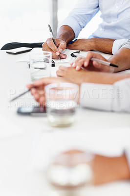 Buy stock photo Hands, meeting and writing with business people at table in boardroom of office together for planning. Collaboration, documents and workshop with employee group in workplace for administration