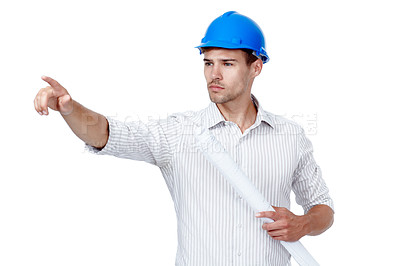 Buy stock photo Architect, man and pointing with blueprint in studio for project, development or direction. Architecture, helmet and contractor with gesture for floor plan, building or inspection on white background